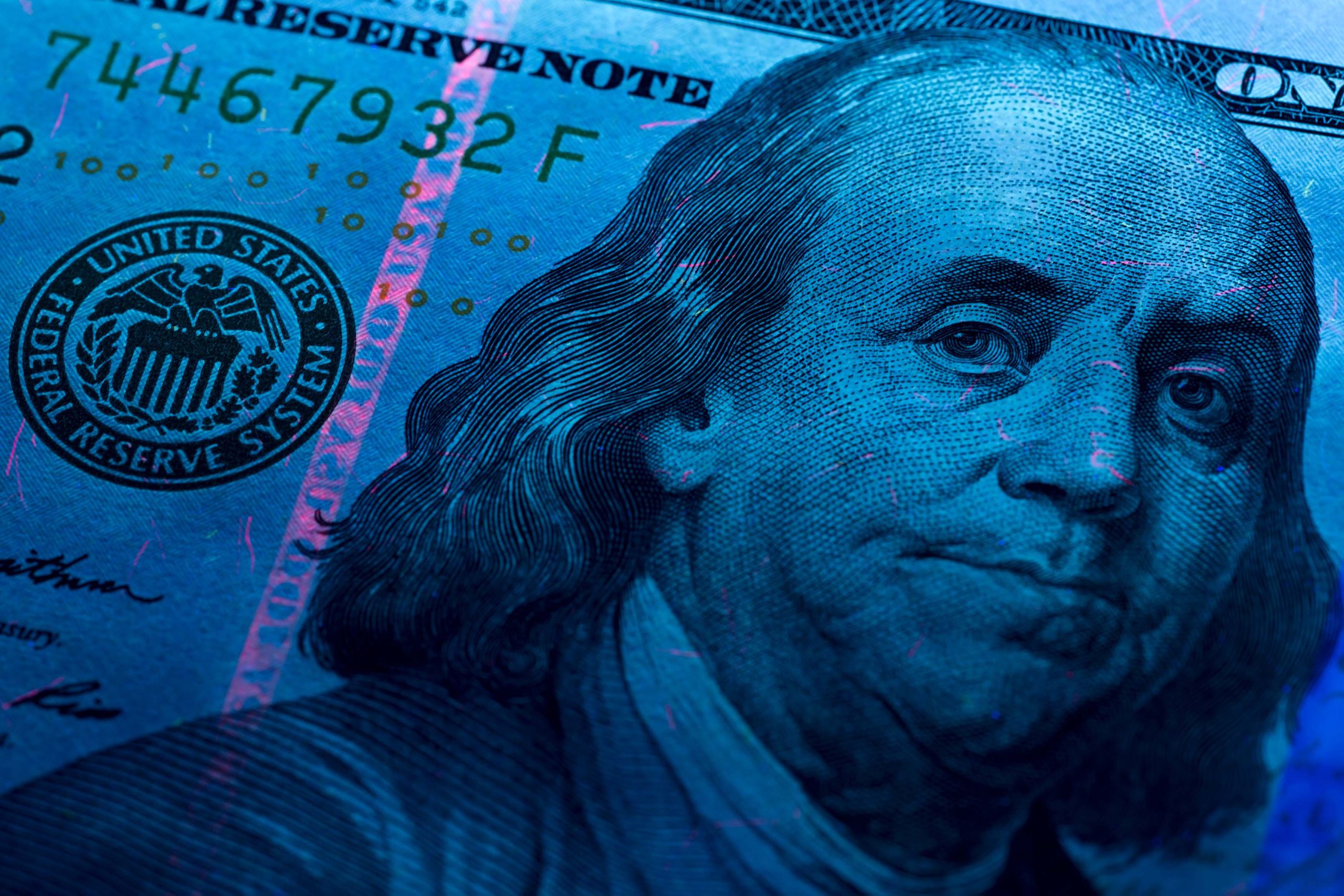 US Dollars under a UV ray
