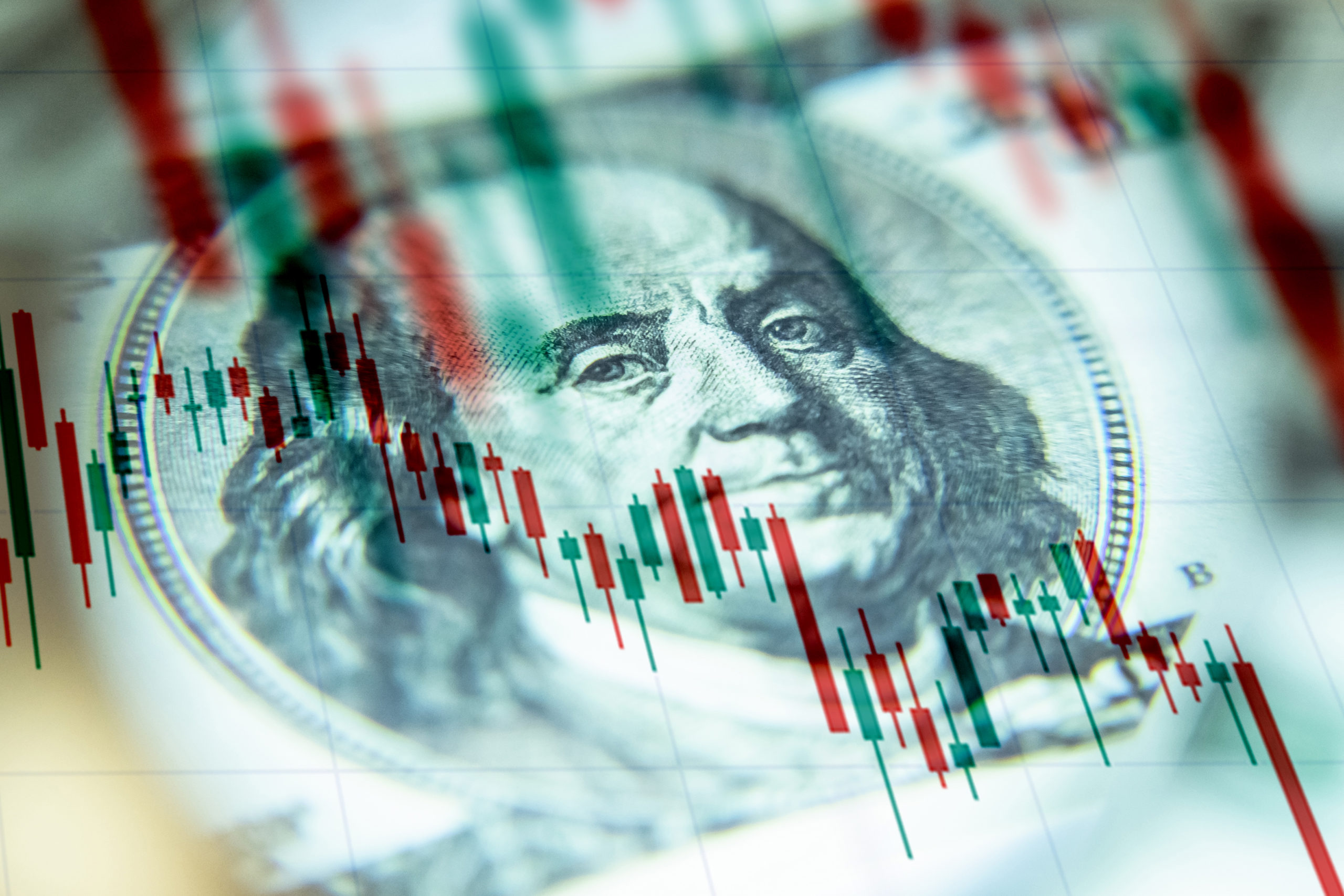 100 US dollar bill with Monetary Policy text showing Fed Hikes Rates U.S. Dollar Falls and Gold Recovers