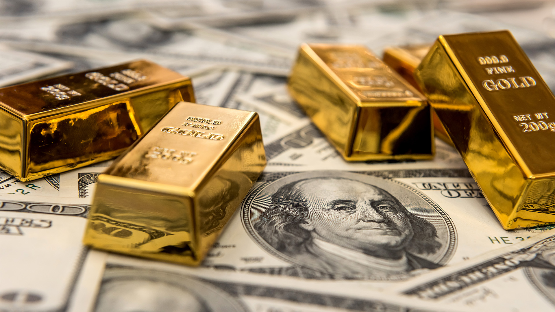 Gold bars and US dollar bills are in demand safe havens
